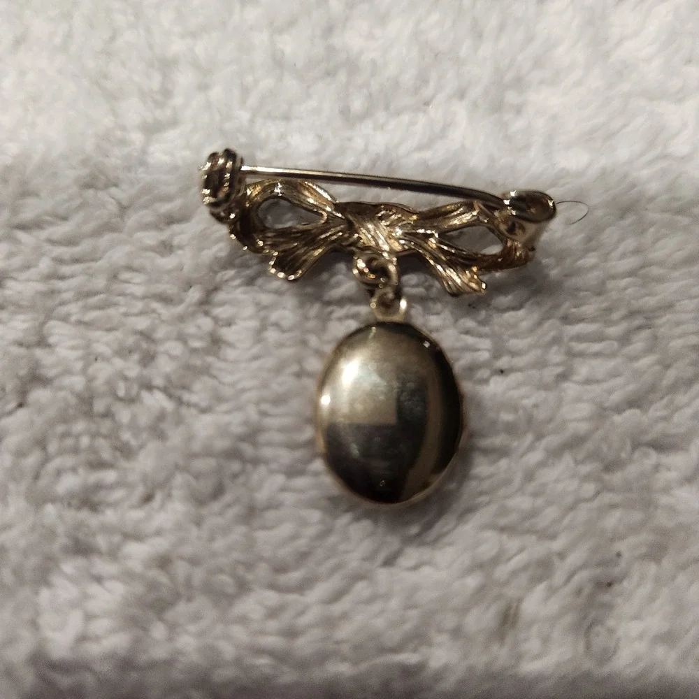 Vintage Gold Tone Bow Brooch with Engraved Floral Oval Dangle Locket Pin